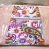 Stunning "Just Peachy" Sunshine Crossbody Crossbody. Measures 10 1/2" wise x 8" tall and 3" deep. $85.00 Colorful paisley floral fabric center, with striking holographic peach glitter vinyl. Rose gold hardware really ins striking in this combination. The exterior back also has a sipper pocket with rose gold zipper teeth and zipper pull. Matching adjustable strap in paisley and can be worn as a side strap or crossbody. Interior is waterproof canvas in rose gold color. It as a roomy slip pocket and zipper pocket.