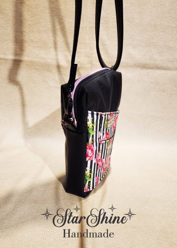 Black Striped Pixie crossbody in a gorgeous striped pink rose print. Side view