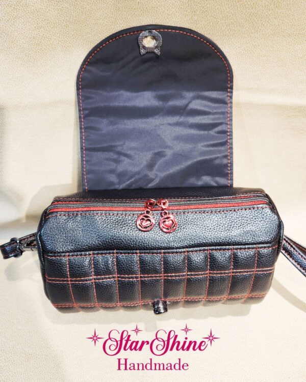 Black and Metallic Red Hearts Barrel Crossbody. Flap open