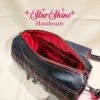 Black and Metallic Red Hearts Barrel Crossbody. Interior View