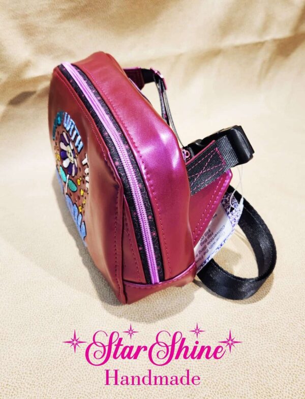 Grow with Flow Magenta Color Shifting Crossbody Bag. Side view.
