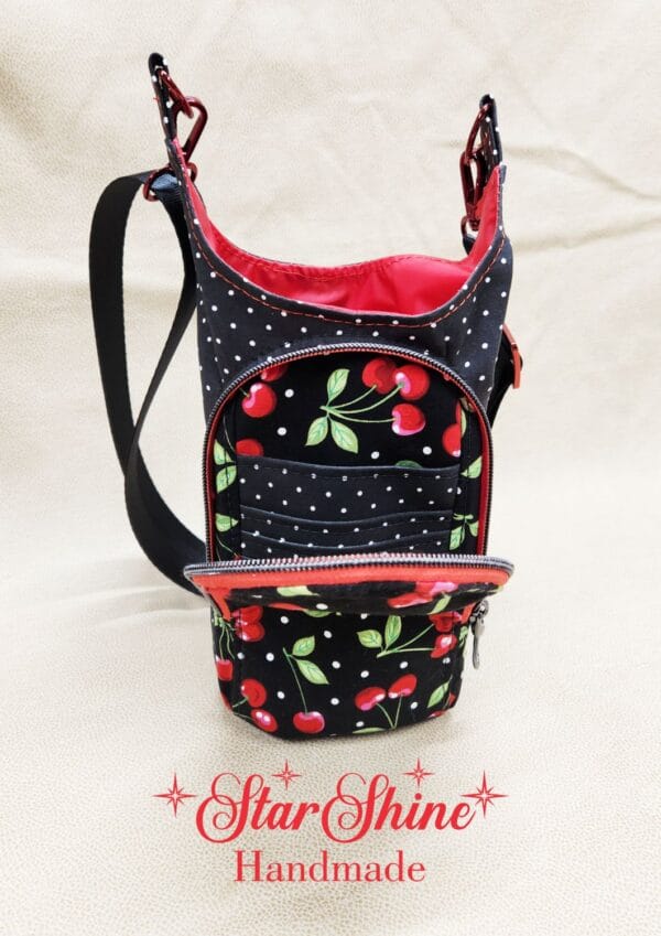 Full front view of Aqua Daisy H2o2Go Crossbody Bag showing front pocket.