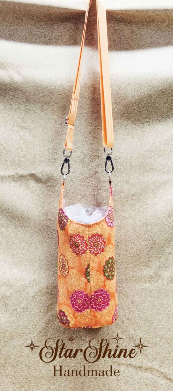 Rear view of Orange Floral Mandala H2o2Go Crossbody Bag