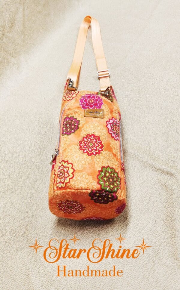 Bottom view of Orange Floral Mandala H2o2Go Crossbody Bag