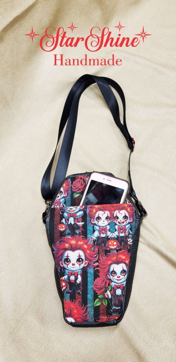 Creepy Clowns Coffin Crossbody. Rear view showing cell phone pocket.